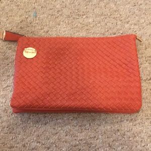 multi use burnt orange handbag